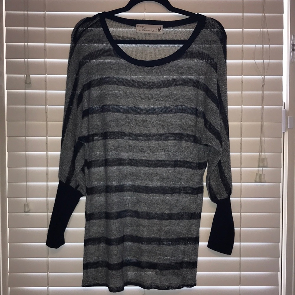 grey and black stripped sweater shirt